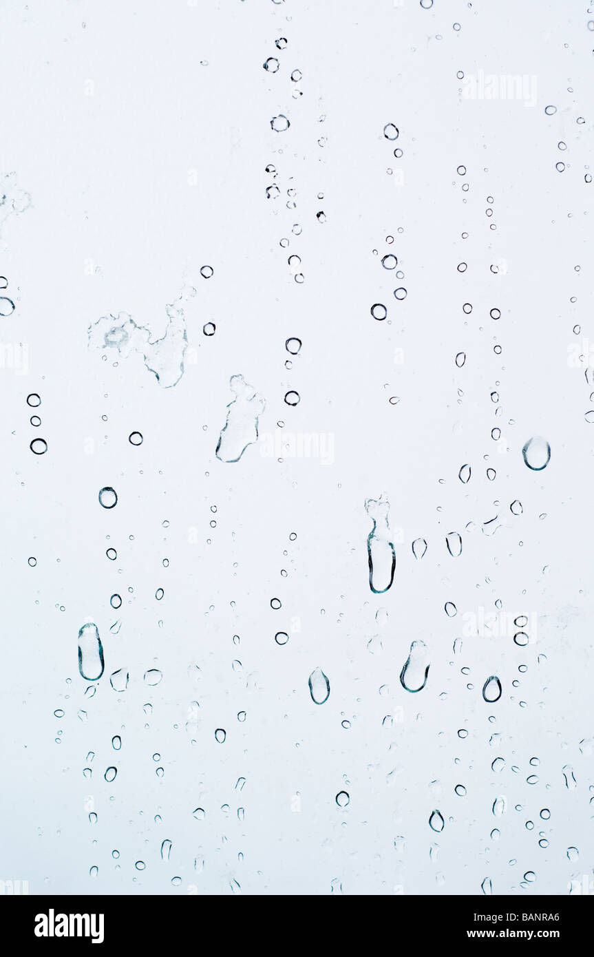 Droplets of rainwater sleet on a glass window pane, Cairnwell Ski Centre, Scotland. Stock Photo