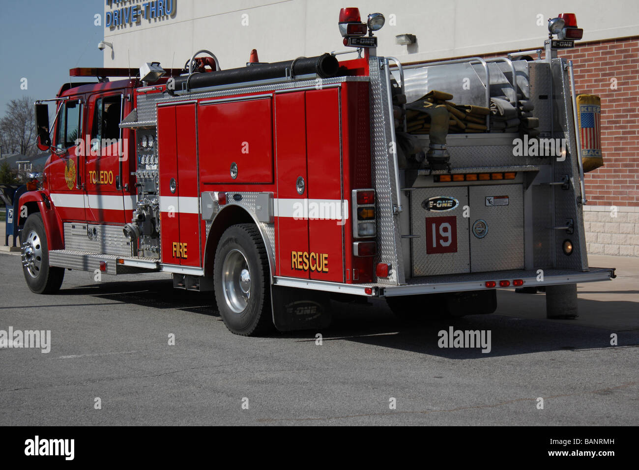 American red fire rescue truck parked in the city road nobody none ...