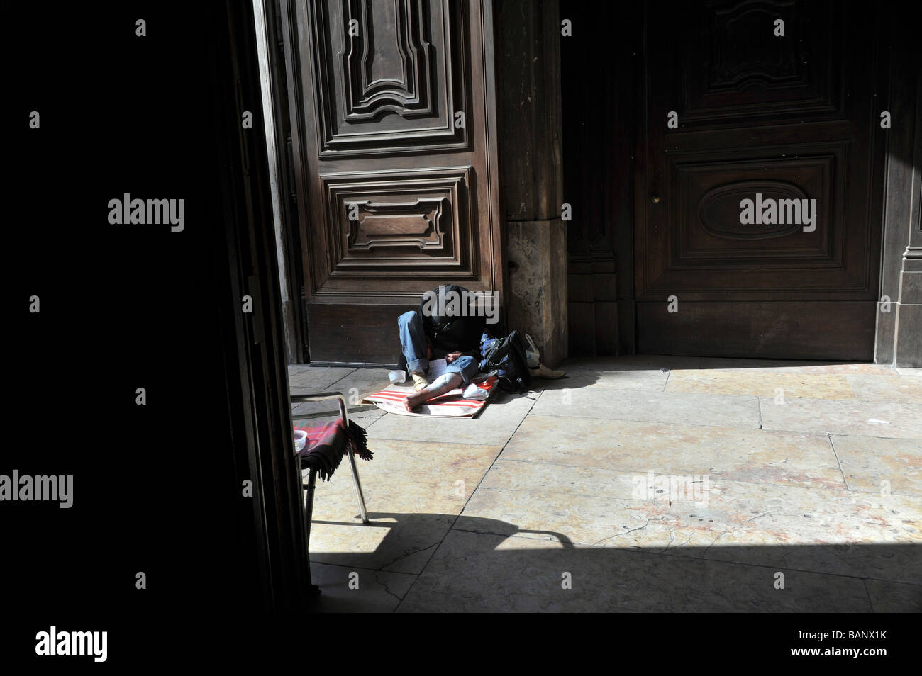 Beggar in Church Entryway Lisbon Lisboa Portugal Stock Photo
