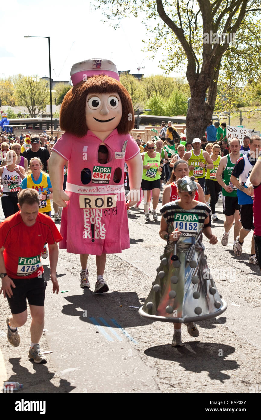 Fancy dress runner dress as a giant nurse on the Flora London Marathon 2009 at Mudchute mile 17 Stock Photo