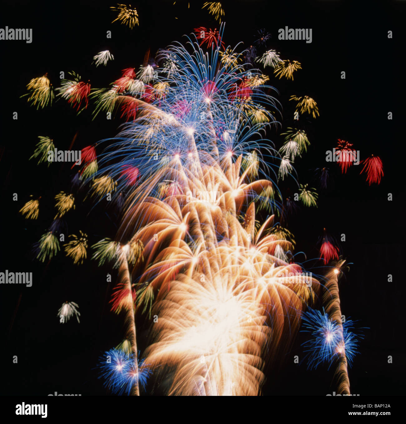 Timed exposure of a fireworks display showing multiple patterns of