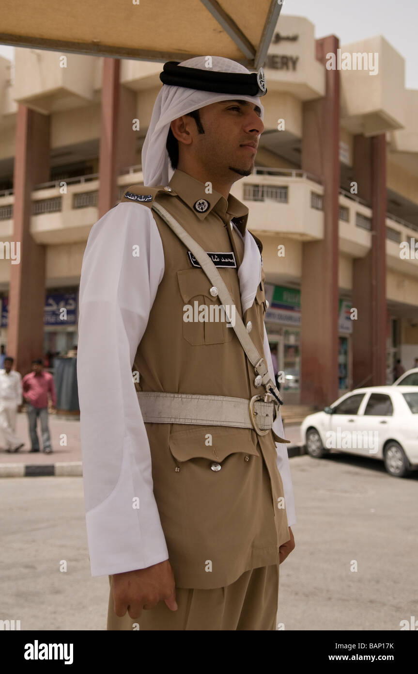 Traffic Policeman on Point duty on a traffic island in the old quarter of Doha, Qatar Stock Photo