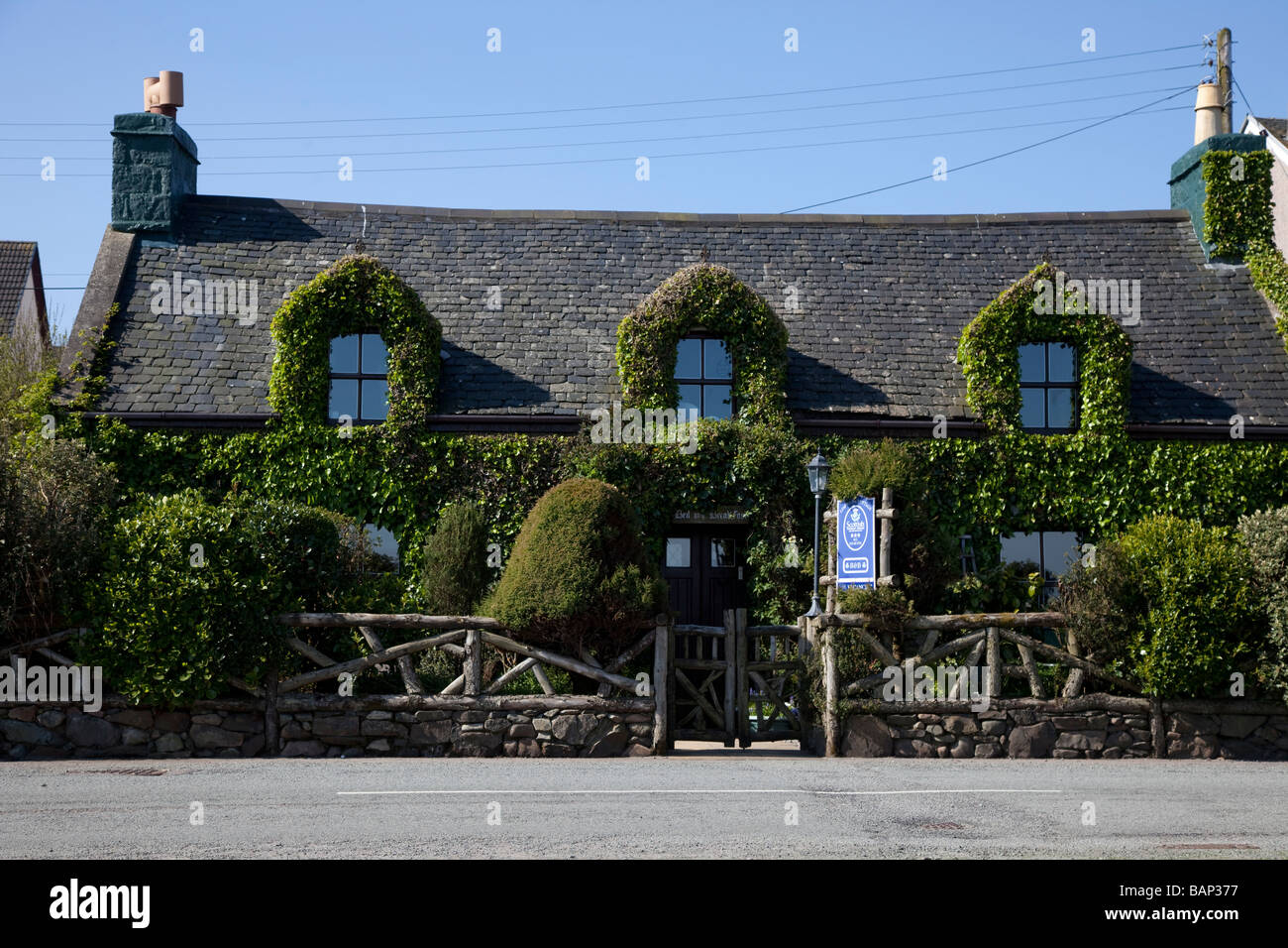 Traditional Scottish Croft; Stone built cottage covered in ivy greenery in Broadford, Isle of