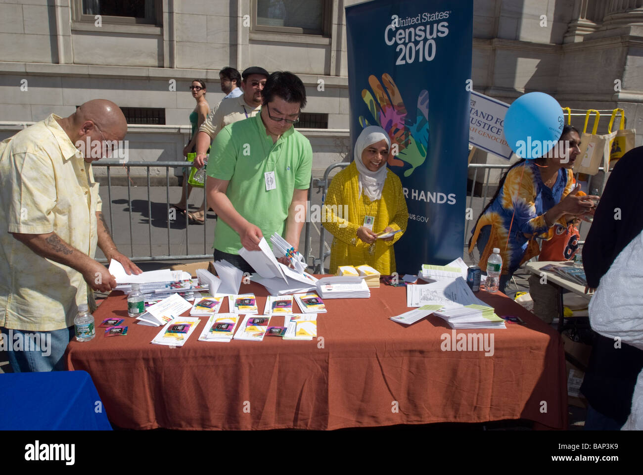 Representatives from the US Census 2010 at a table in the street fair in New York Stock Photo