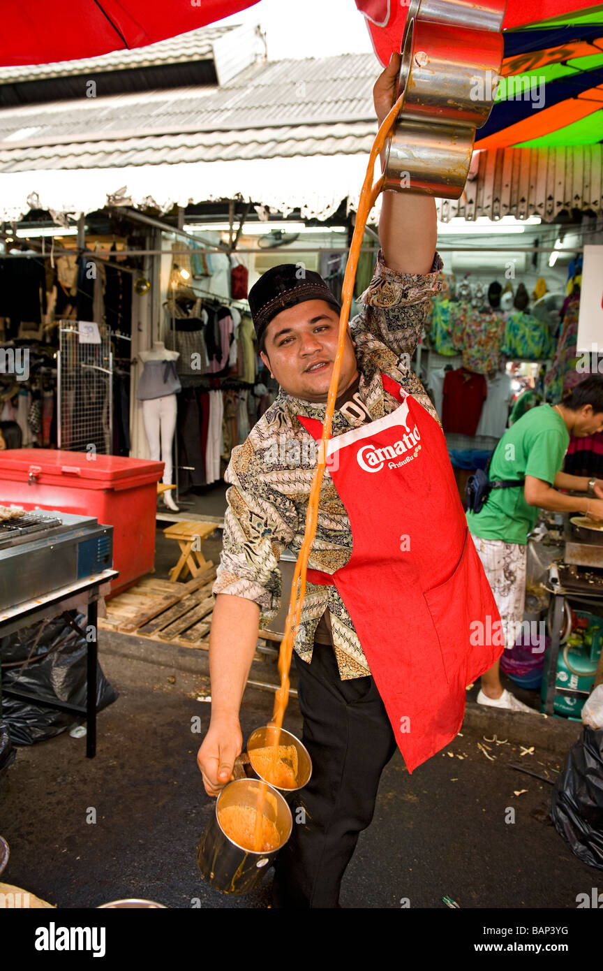 Vendor skillfully blending Thai Spiced Iced Tea. Chatuchak Weekend