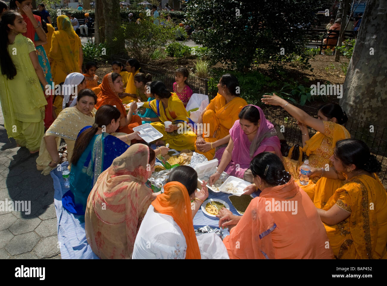 Women picnic in Madison Square Park after the 22nd Annual Sikh Day Parade in New York Stock Photo