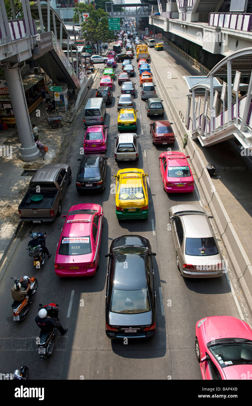Colourful Taxis and Heavy Traffic on Silom Road. Bangkok, Thailand. Stock Photo