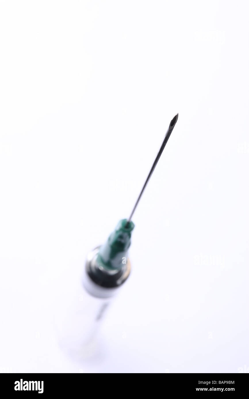 Detail of needle on a disposable hypodermic medical syringe. Stock Photo