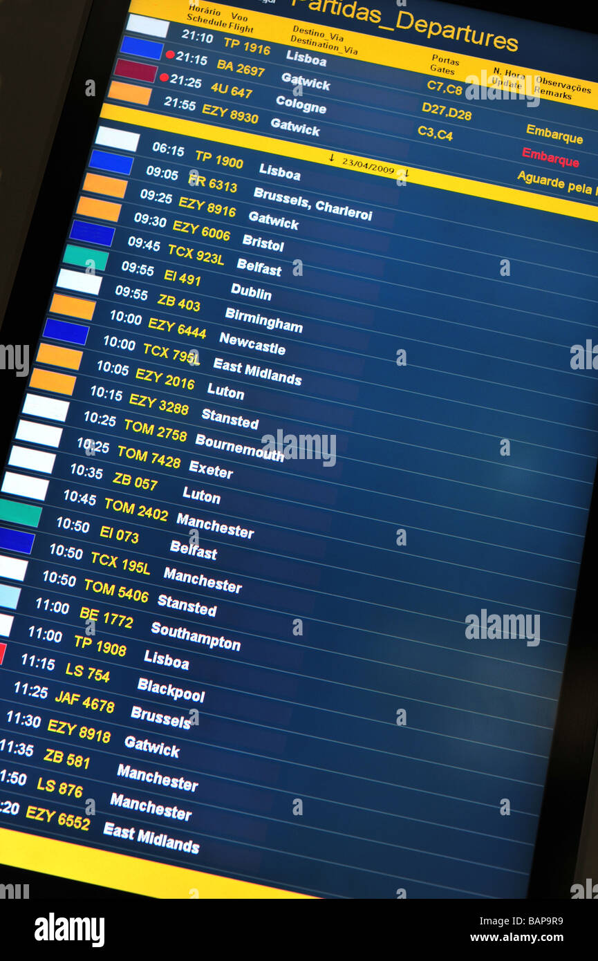 Airport flight arrivals and departures information board. Image taken at Faro airport, Algarve, Portugal Stock Photo