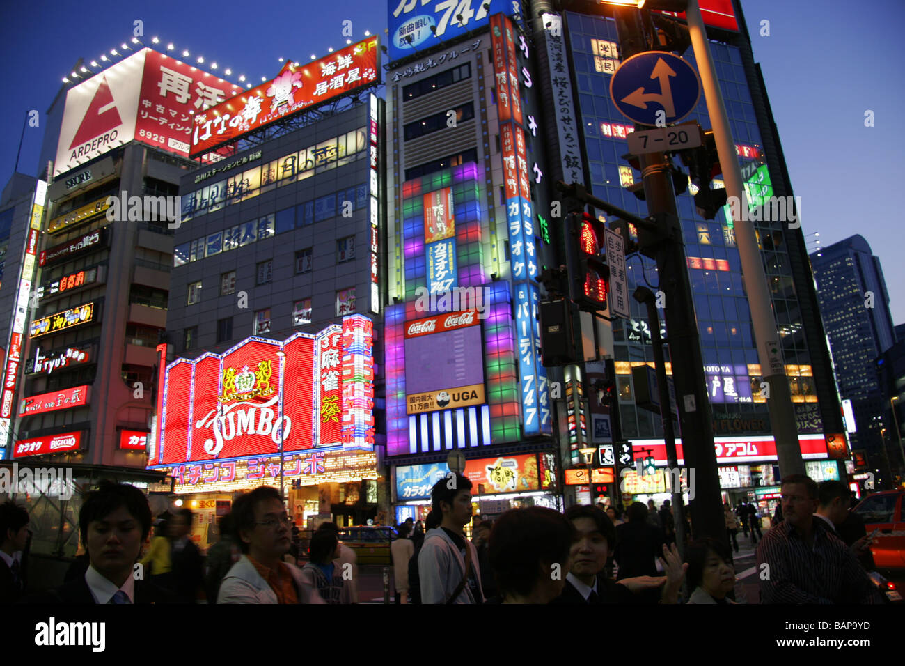 Neon lights and crowds in Shinjuku district Tokyo Japan Stock Photo