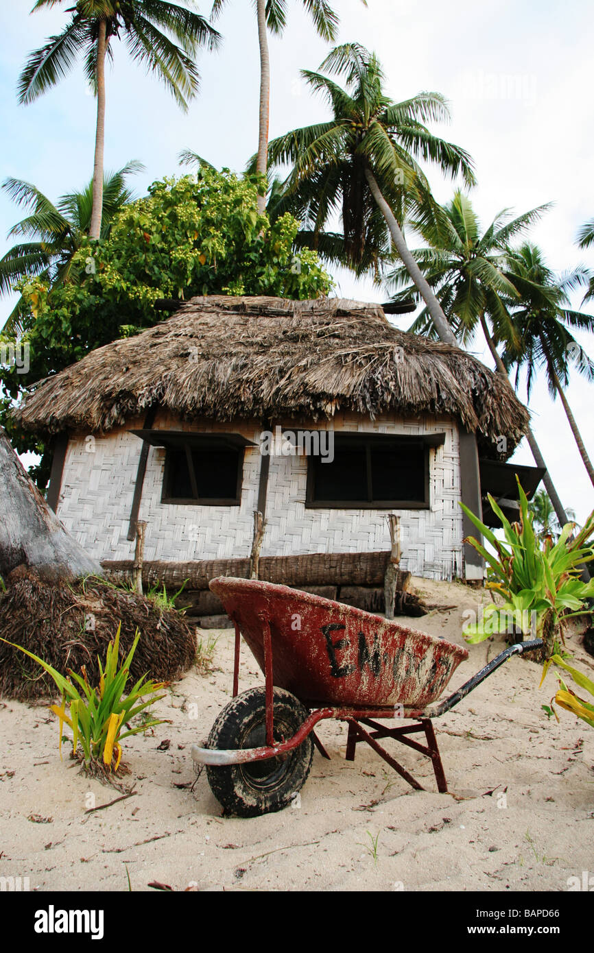 Fijian hut and wheelbarrow Stock Photo