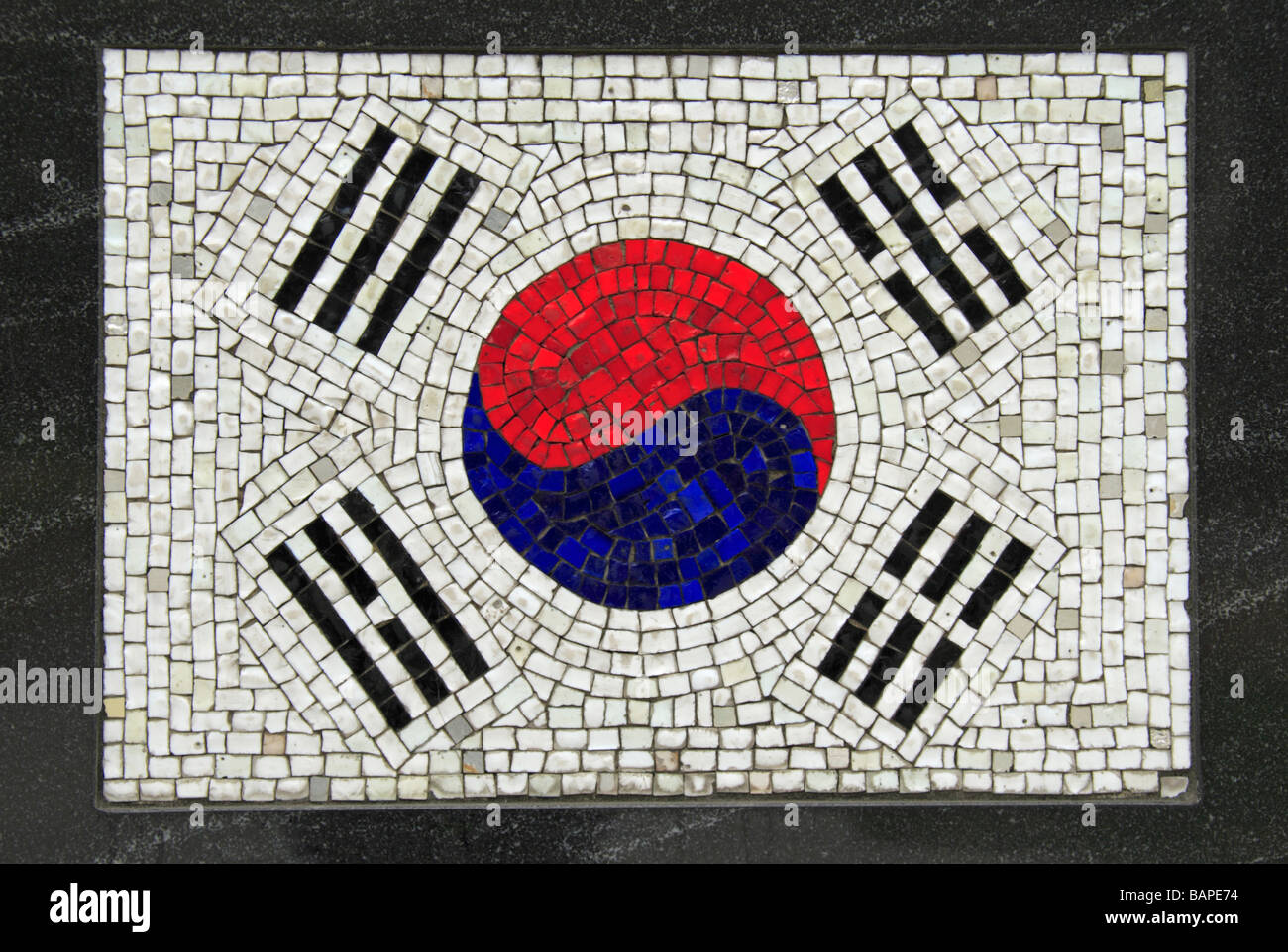 A mosaic of the Korean flag below 'The Universal Soldier', the Korean Veterans Memorial, Battery Park, New York, United States. Stock Photo
