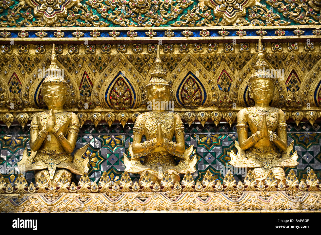 Close up of gilded garudas surrounding the Royal Pantheon. Wat Phra Kaew, Bangkok, Thailand Stock Photo