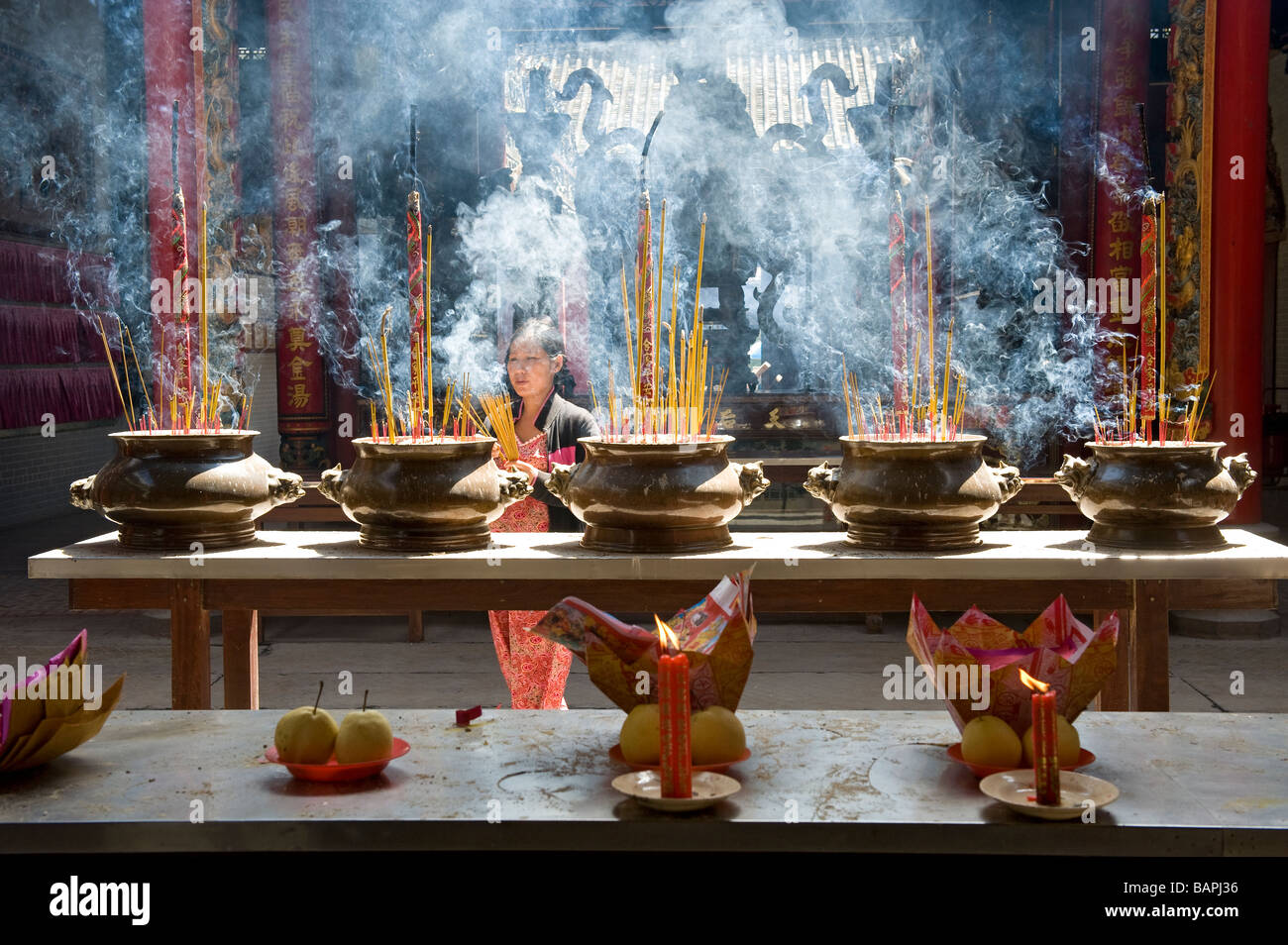 Incense and Candles Burning in Thien Hau Temple, Ho Chi Minh City, Vietnam. Stock Photo