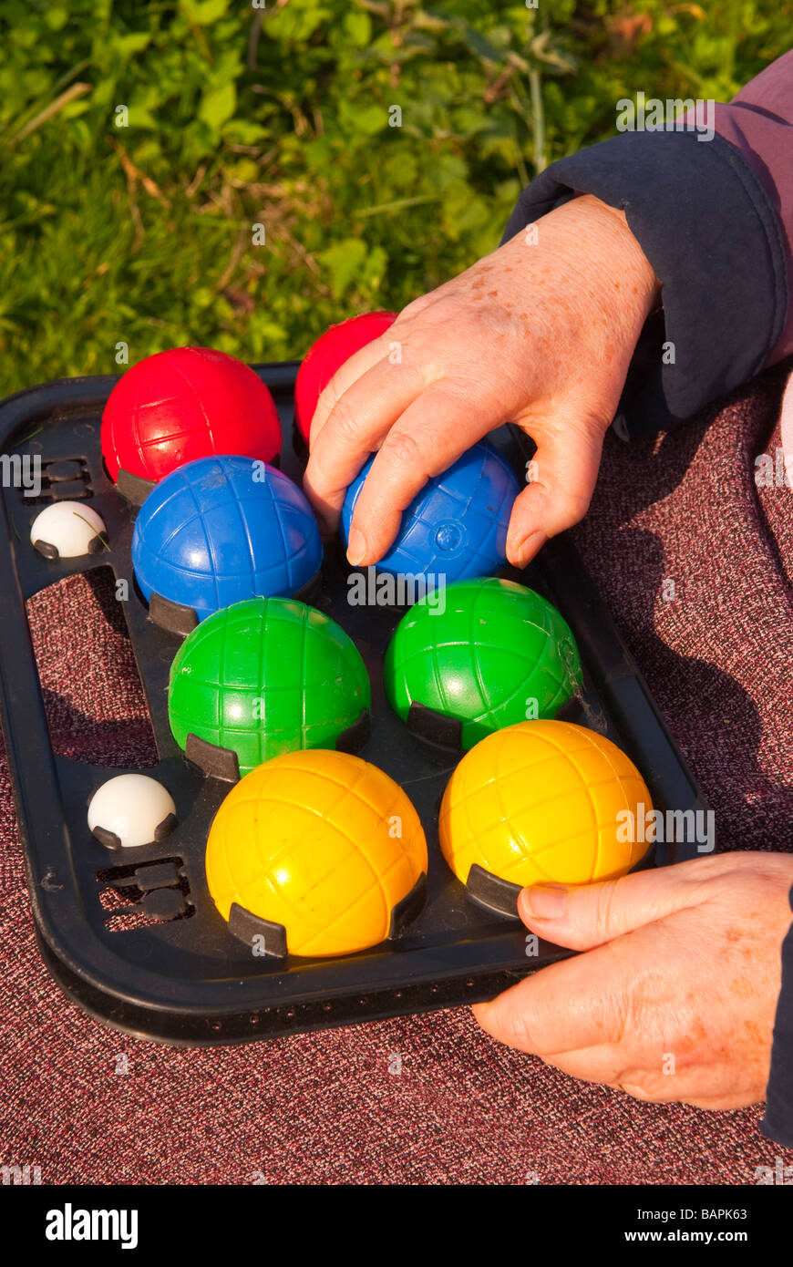 A set of coloured garden bowls for outdoor bowling Stock Photo