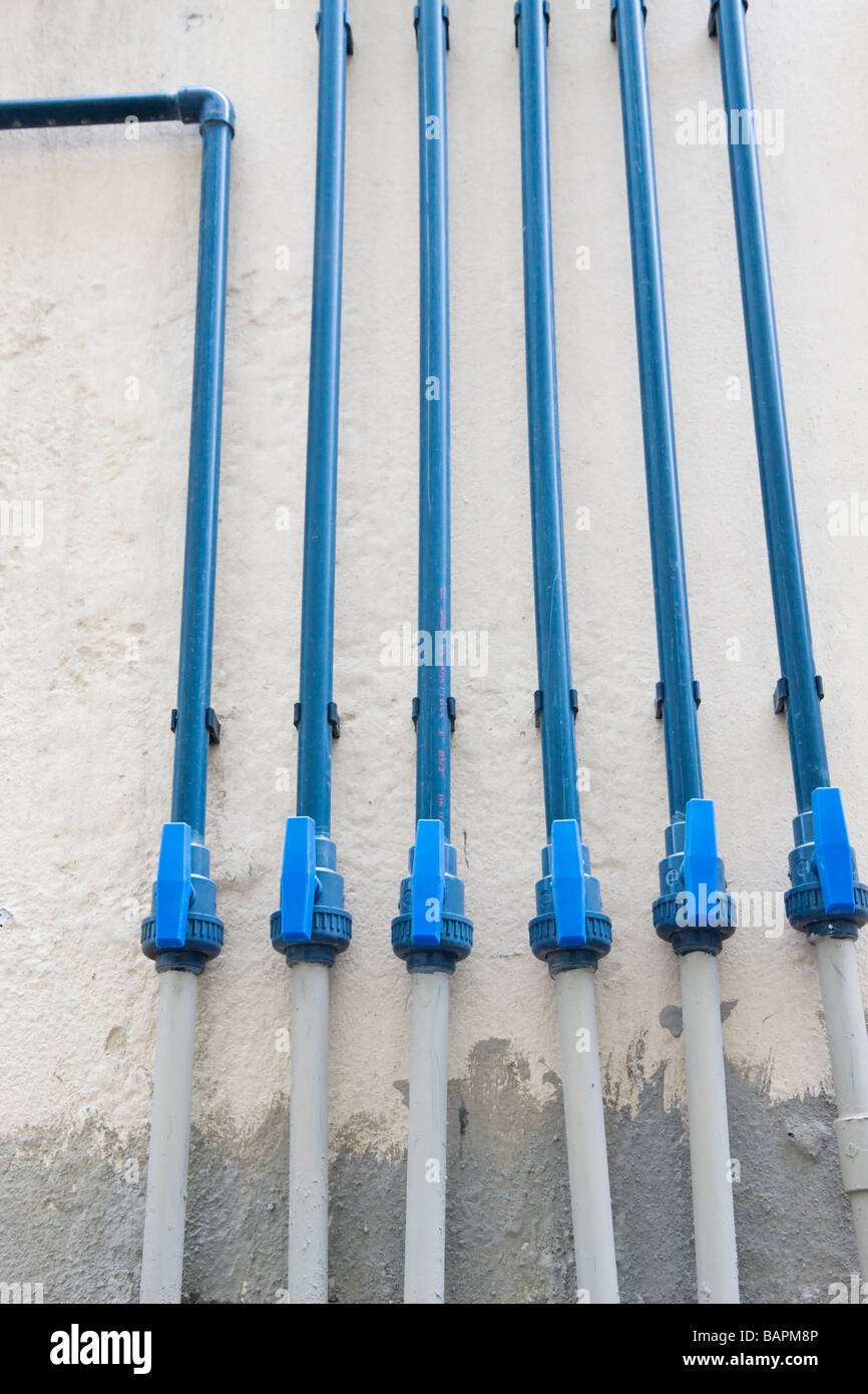 Water pipes in open position on exterior of building Stock Photo Alamy
