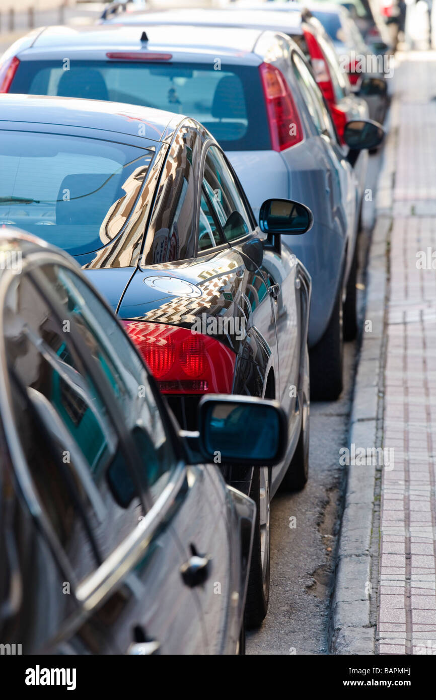 Row of parked cars on a street Stock Photo - Alamy