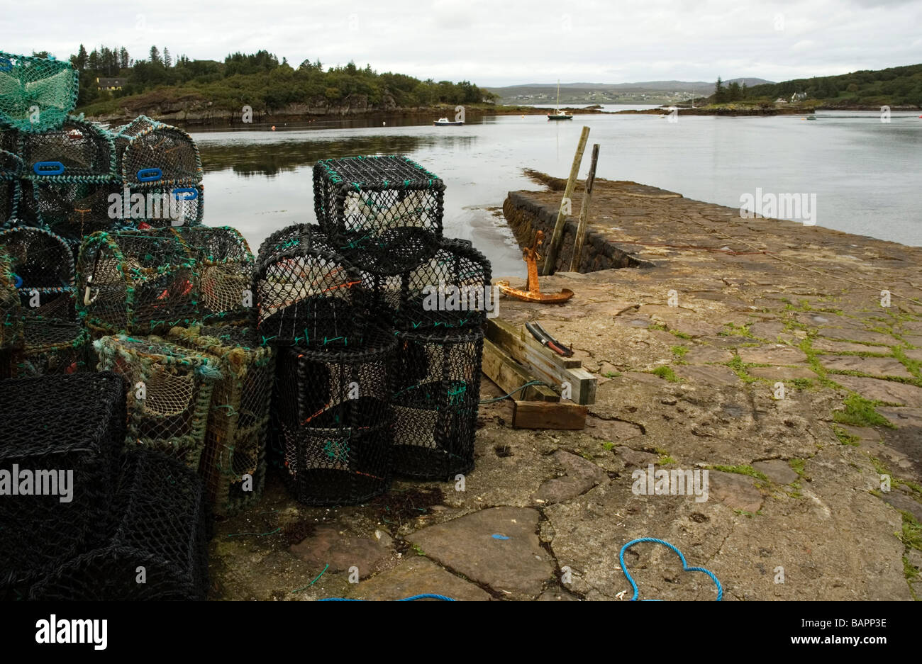 Lobster pots on the quay at Badachro, Gair Loch, Highlands of Scotland. Stock Photo