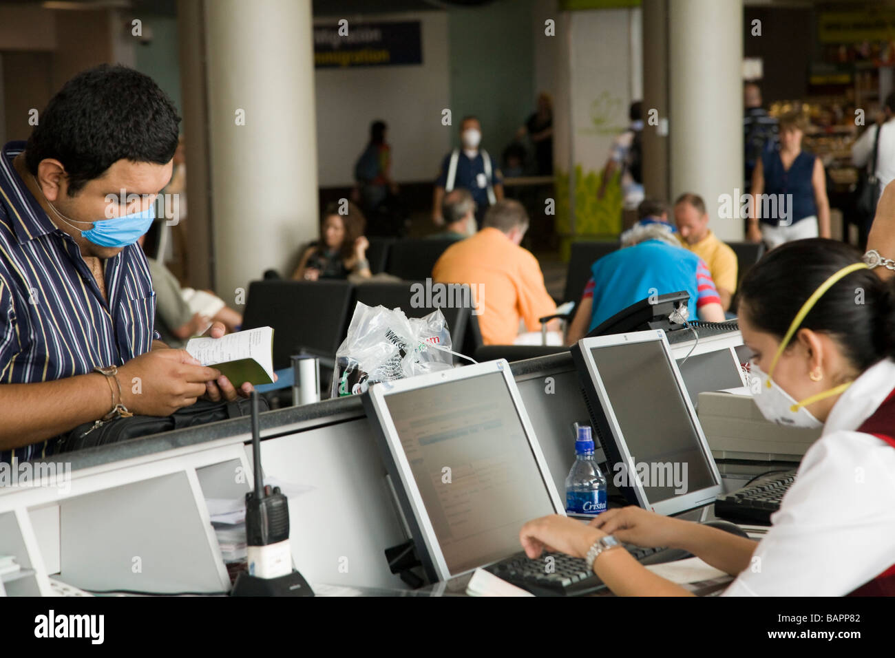 persons wearing a face masks at airport Stock Photo Alamy