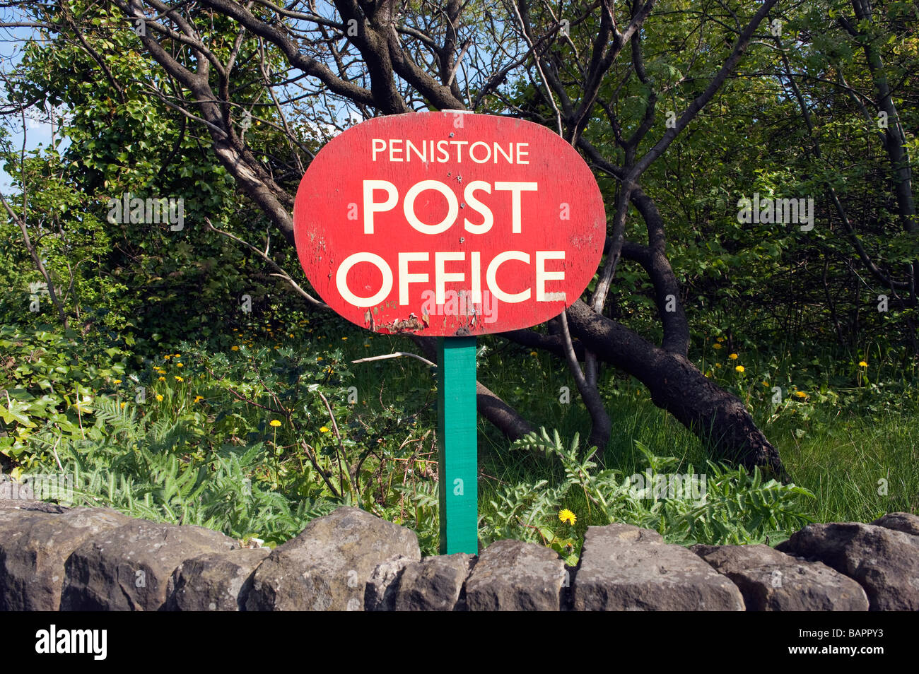 Red Wooden Post office sign in Penistone, 'South Yorkshire', England Stock Photo
