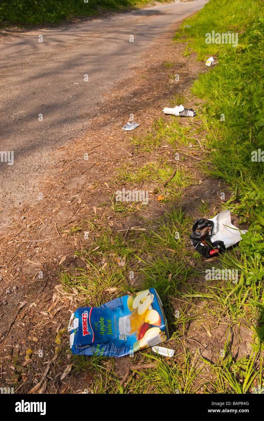 Rubbish dumped at the side of the road in the Uk countryside Stock ...
