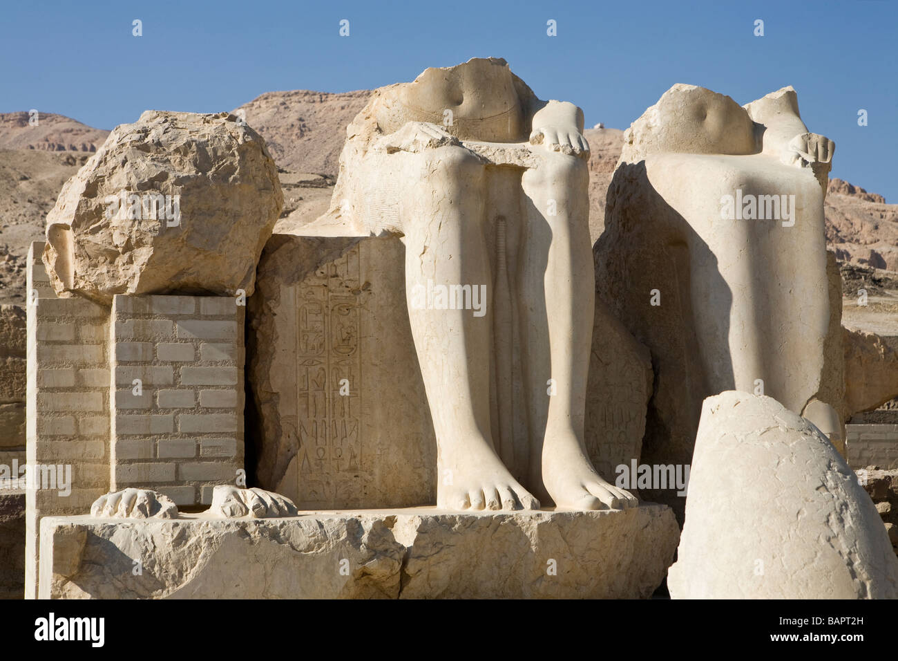 Broken statues in the openair museum at the Mortuary Temple of