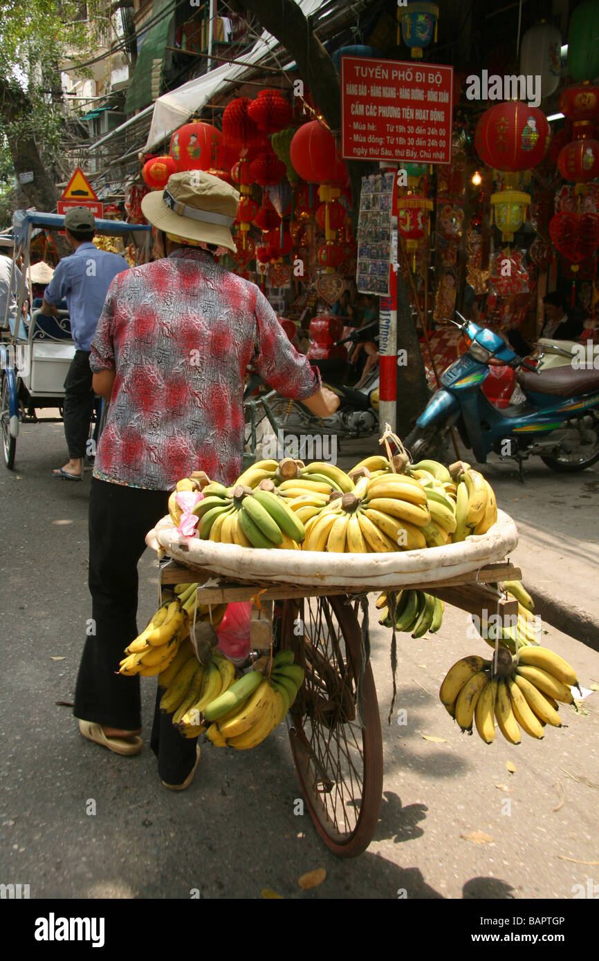 Bananas loaded onto a bicycle to be sold in Hanoi, Vietnam Stock Photo