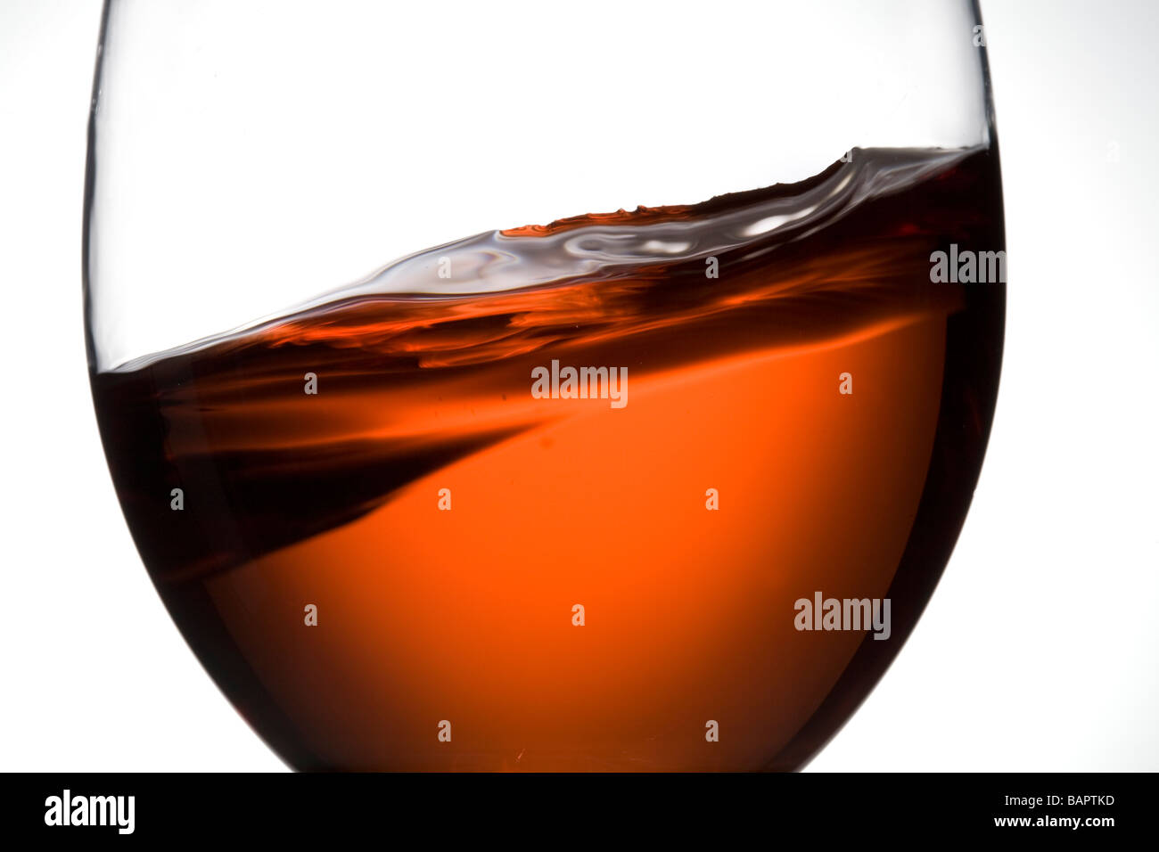 glass of rose wine swirling swirl Stock Photo