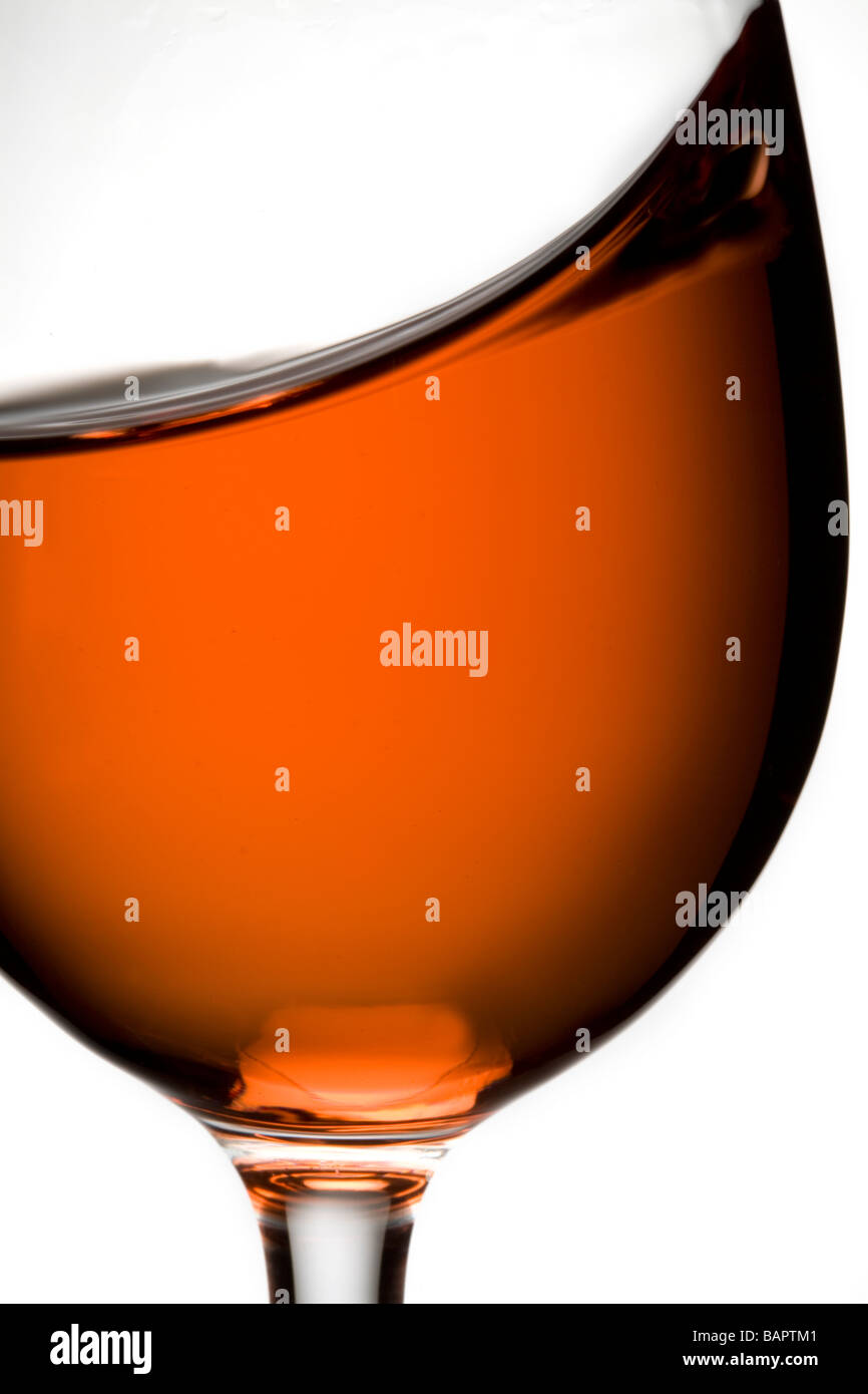 glass of rose wine swirling swirl Stock Photo