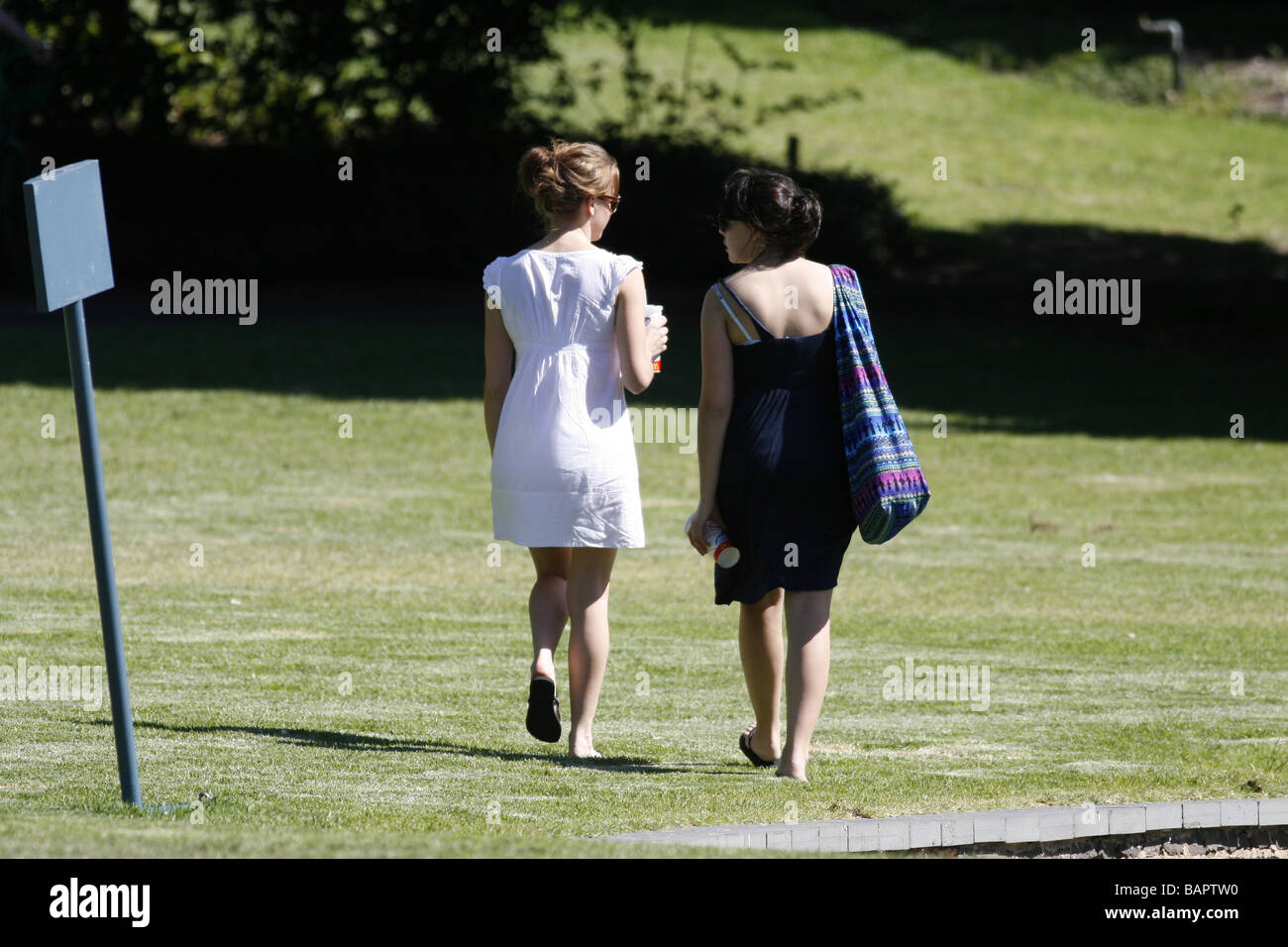 Two young women in park hi-res stock photography and images - Alamy