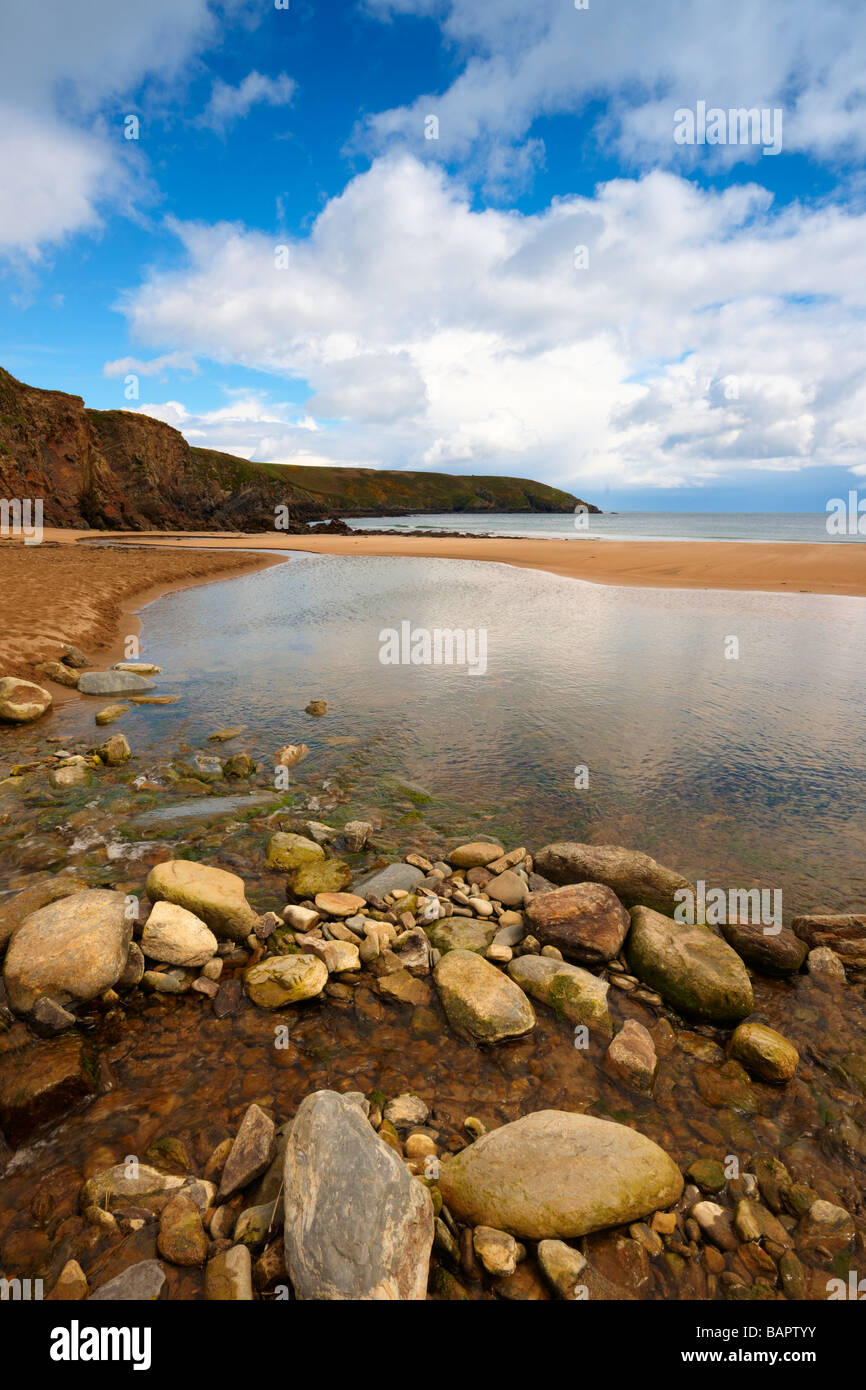 Ireland Bay Rocks Rocky Bay Co Cork Republic Of Ireland at low tide showing blue sky sand ...