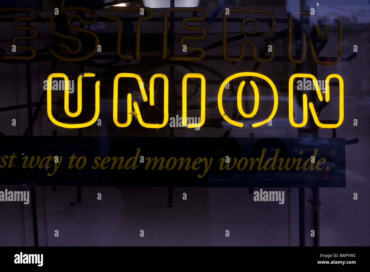 The word Union displayed in yellow neon in a storefront window Stock Photo