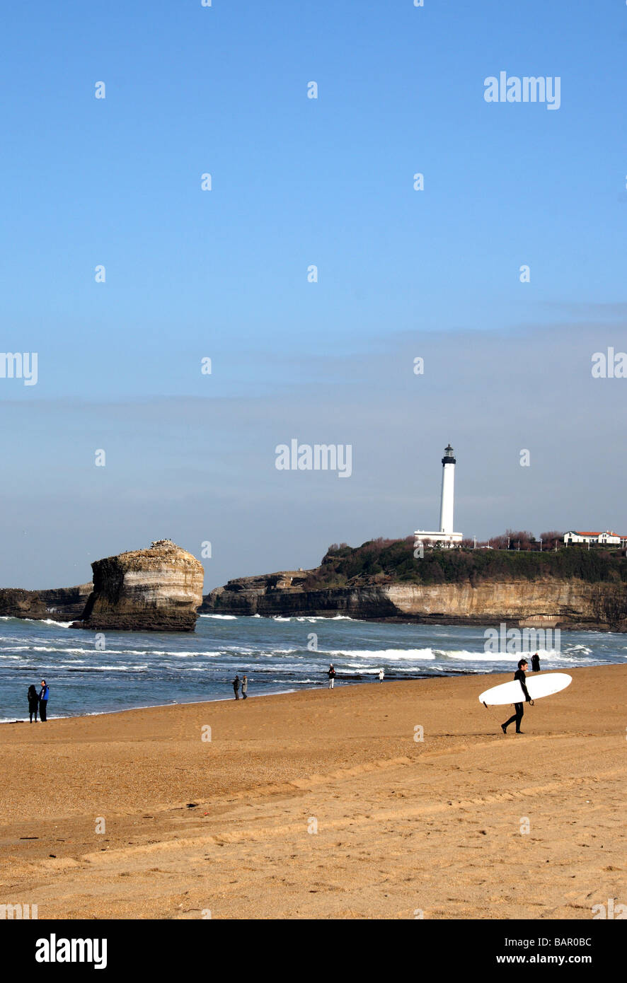 A surfer on the beach of Biarritz, in the Pays Basque region of south west France. Stock Photo