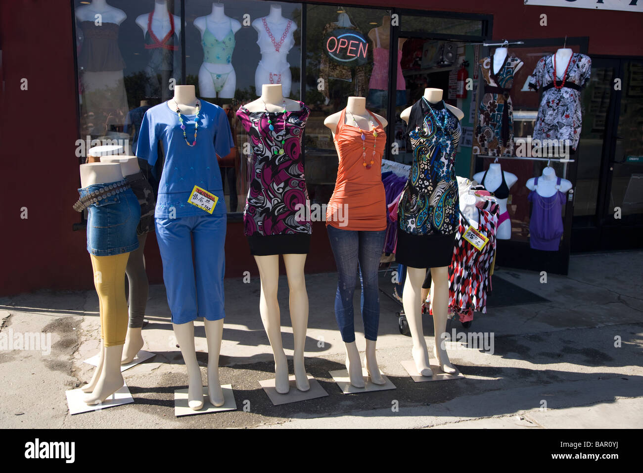 Mannequins standing outside of rural  clothing store. Stock Photo