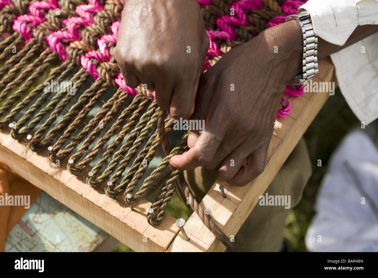 African Artisan Making A Hand Woven Doormat Kenya Stock Photo