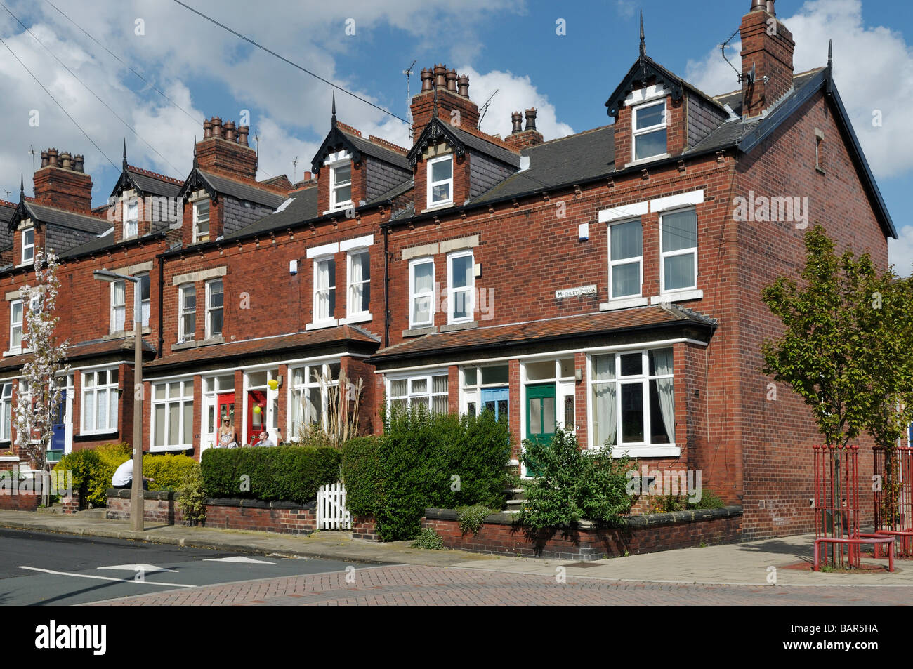 Victorian red brick back to back working class terrace houses with bay and dormer windows Chapeltown area Leeds West Yorkshire Stock Photo