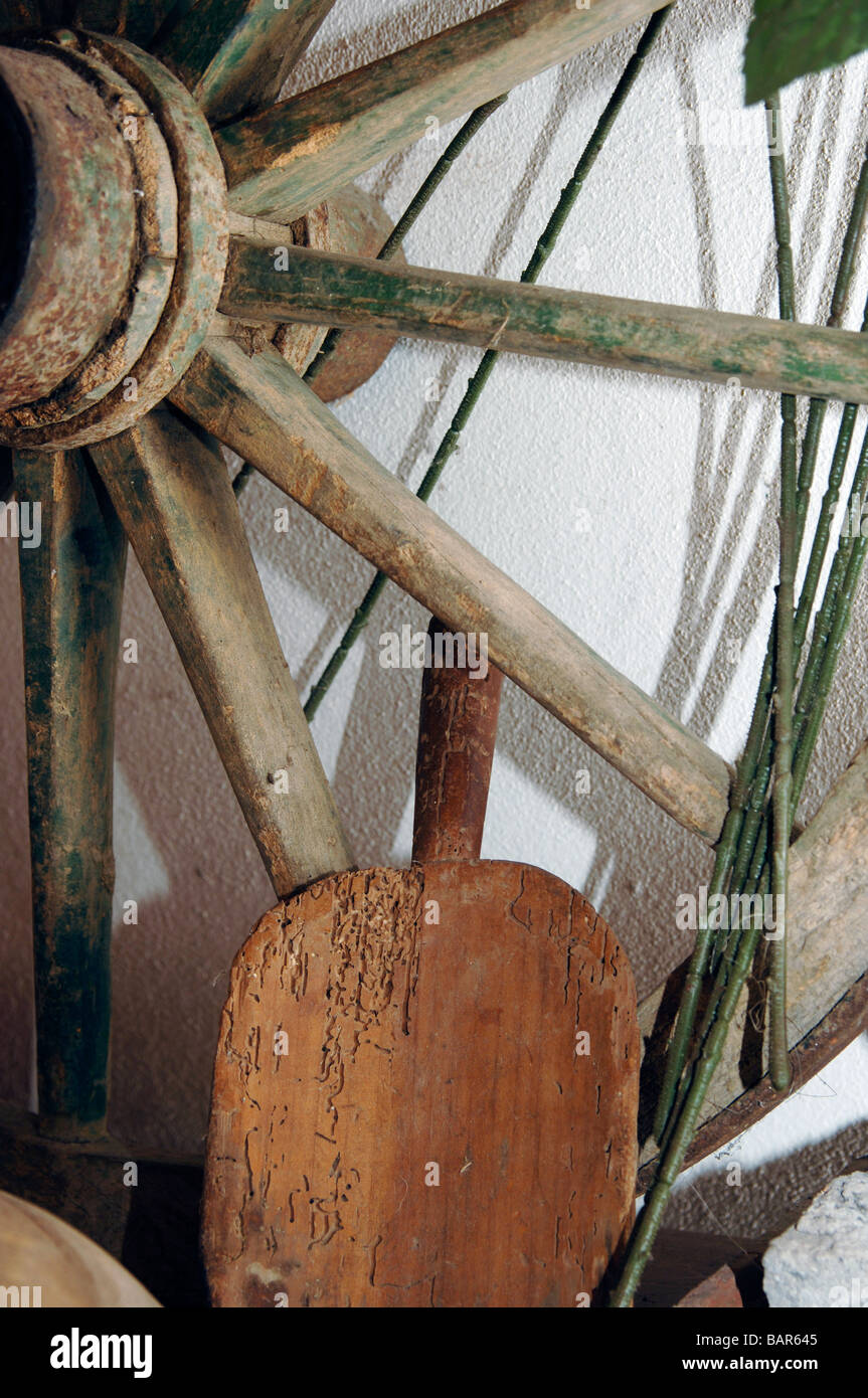 Wagon wheel and wooden shovel, close-up Stock Photo