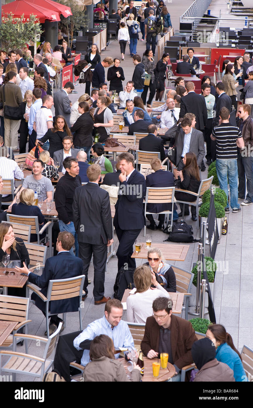 Busy bars and restaurants in St Katharine Docks London United Kingdom Stock Photo
