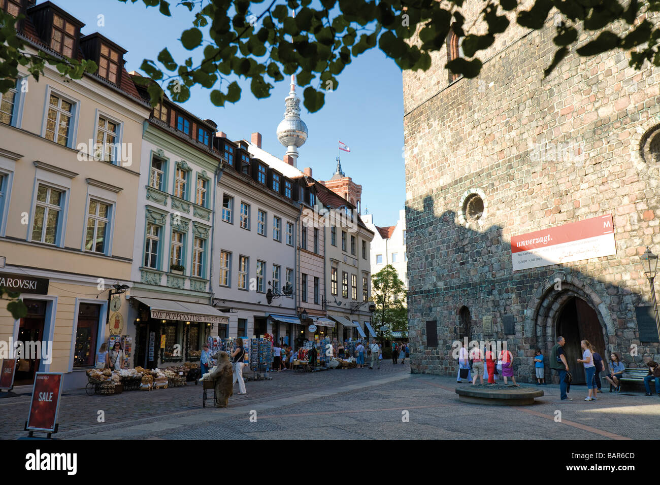 Germany, Berlin, Nikolaiviertel, Pedestrians in front of Nicolai church Stock Photo