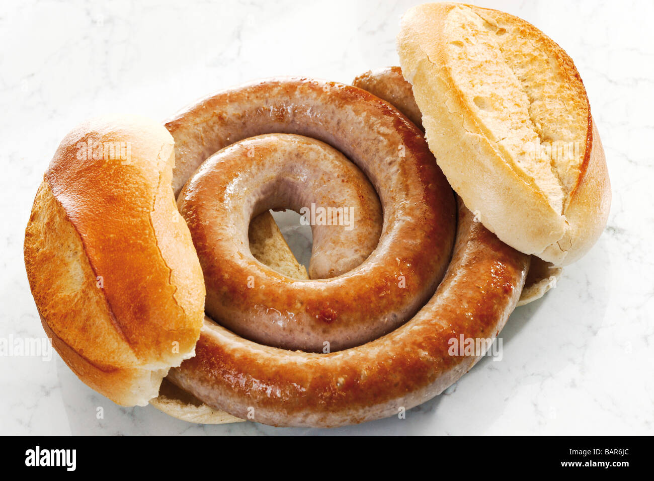 German Bratwurst, fried sausage and bread roll, close-up Stock Photo