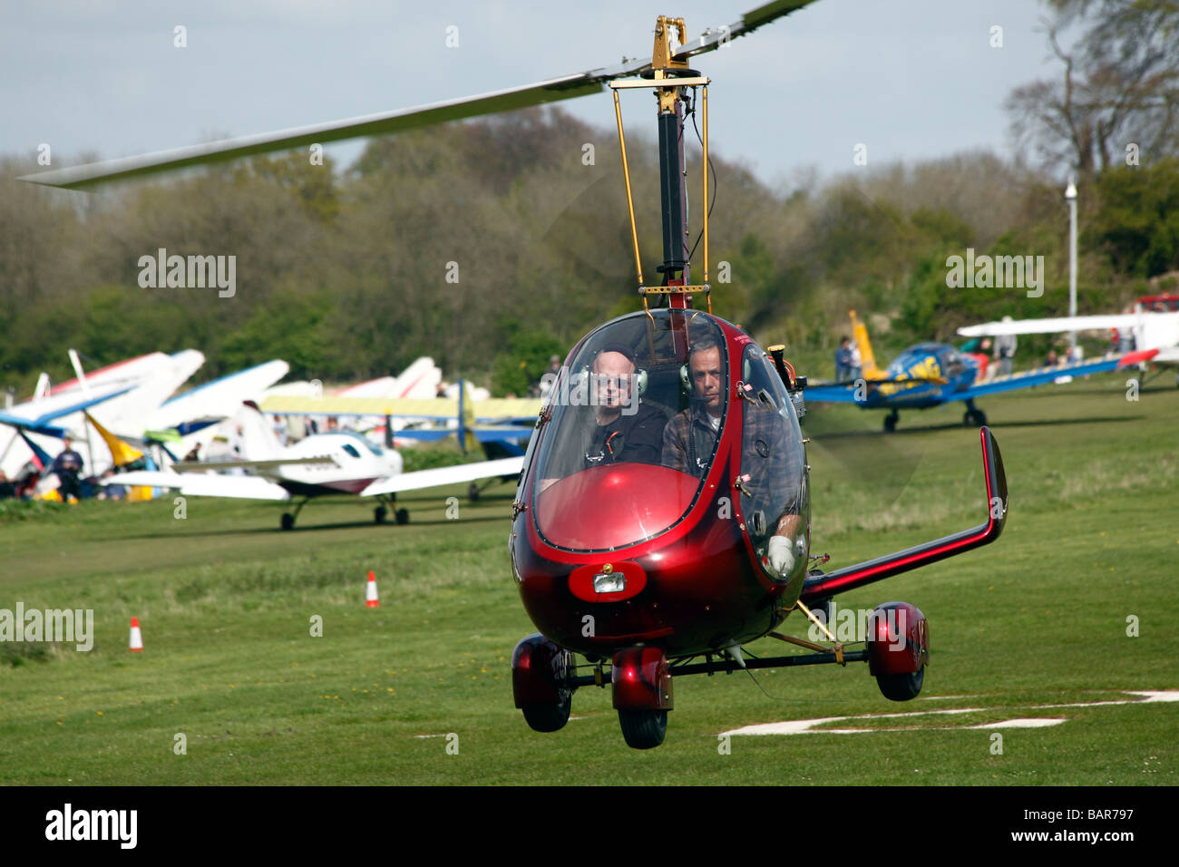 An autogyro flying at Popham airfield in Hampshire in England Stock Photo
