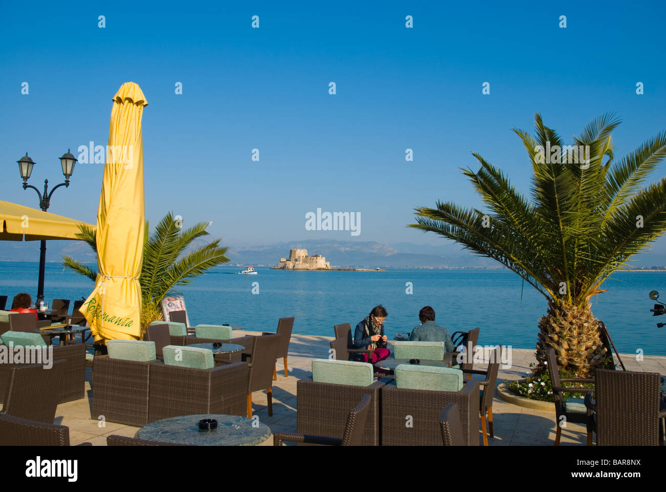 Cafe terraces at Plateia Filellinon square in Nafplio Peloponnese Greece Europe Stock Photo