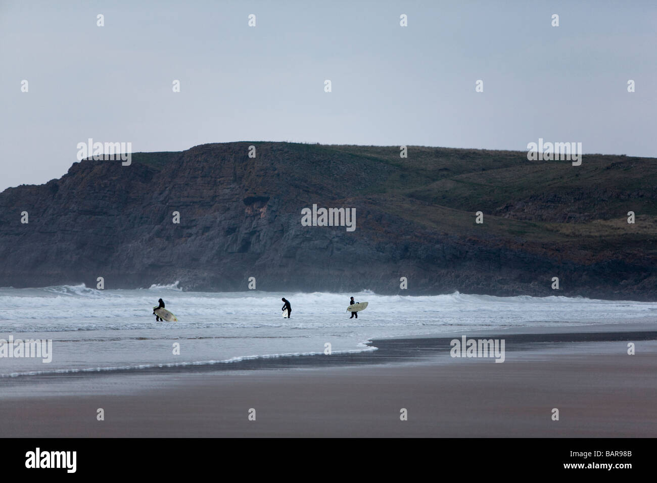 Surfers on the Gower. Stock Photo