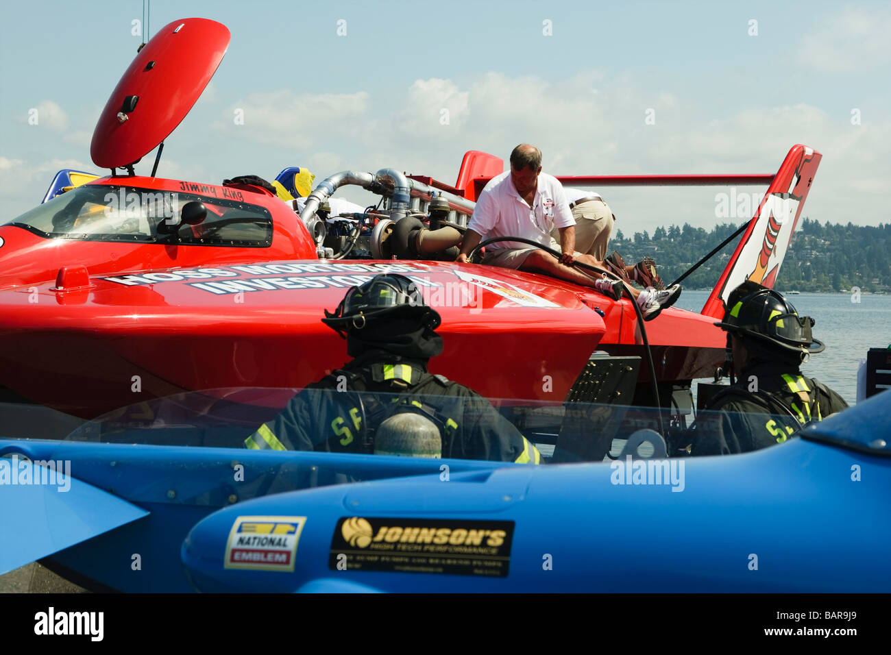 Seattle Seafair's Chevrolet Cup: Pit crew refuel 'Hoss Mortgage Investors II' as firemen stand by. Stock Photo