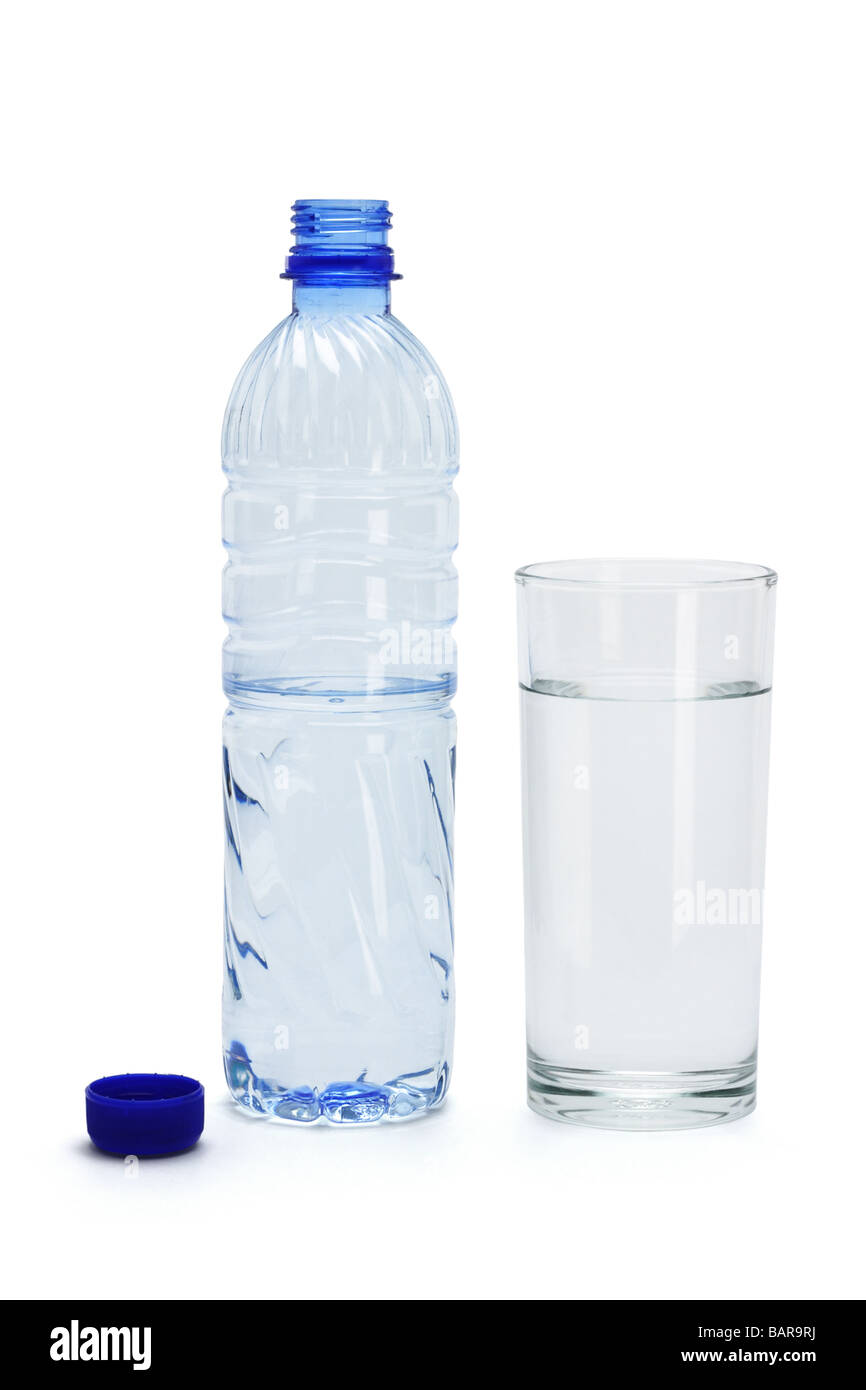 Mineral water in a glass and an open plastic bottle on white background Stock Photo