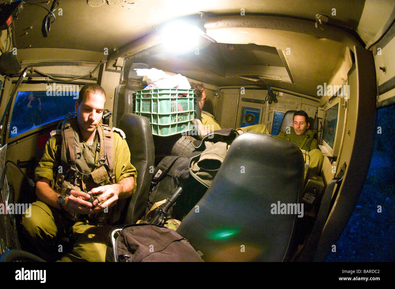 Israel West Bank Israeli reserve soldiers on patrol during active duty Interior of the armoured jeep Stock Photo