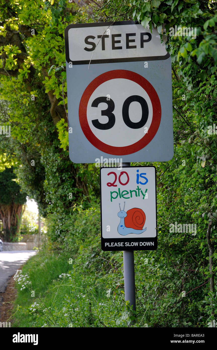 20 is plenty speed limit road signs 30 mph english village England UK Stock Photo