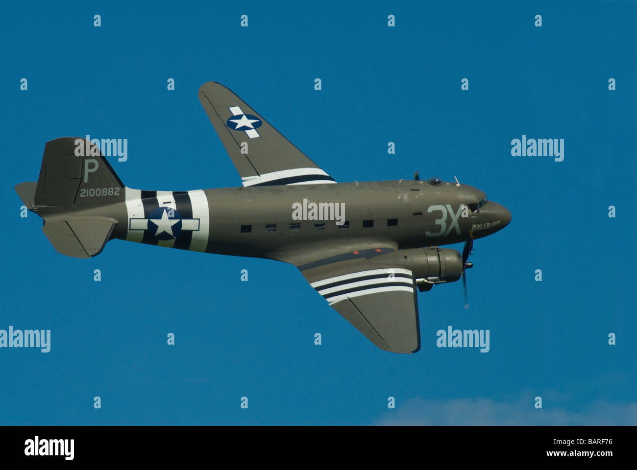 A DC3 Dakota Transport Plane on a display flight at an airshow with D Day Livery Stock Photo