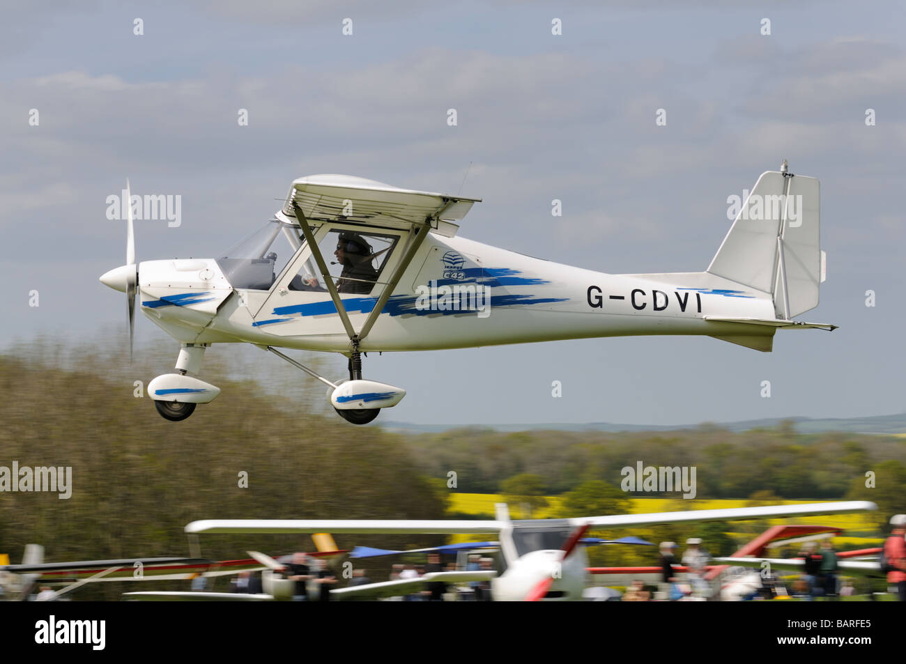Aerosport Ikarus C42 Microlight G-CDVI takes off from Popham airfield Basingstoke Stock Photo