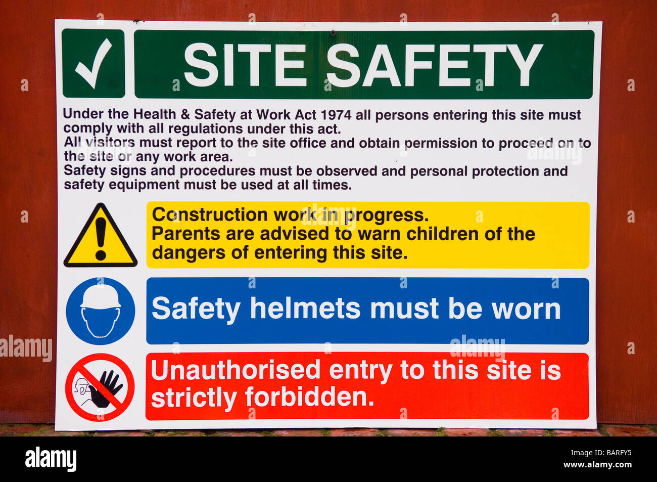 Health and safety instructions sign outside a construction site Manchester UK Stock Photo